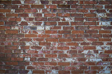 Red old worn brick wall texture background.