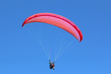 Tandem paraglider flying
