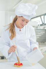 woman basting on a pastry