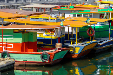 Fototapeta na wymiar Several colorful and poor boats tied up in the Urca neighborhood (Rio de Janeiro, Brazil)