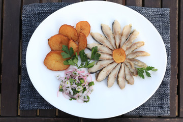 Slices of herring with potatoes