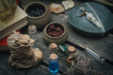Obraz na płótnie Canvas Magic potion preparation on the table of magician. Witchcraft or druidism concept background.