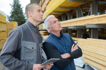 inspecting the wooden planks