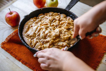 Apple Pie in vintage form. Apple home-made pie cut into shape and take out a piece of cake