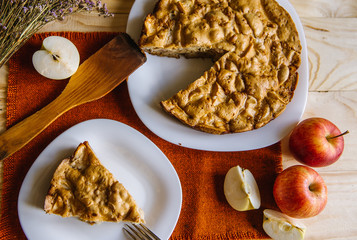 Homemade apple pie. Autumn composition with apples and pie. Flat lay food background.