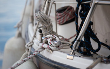 Boat tied to dock with ropes