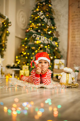 Christmas baby boy with red candy cane