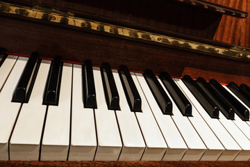Fototapeta na wymiar Close up of the keys of an old piano