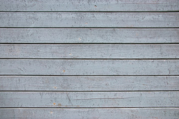 Obraz na płótnie Canvas Aged painted gray wooden background horizontal lines