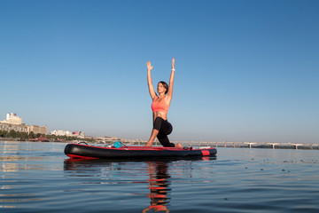 SUP Stand up paddle board woman paddle boarding