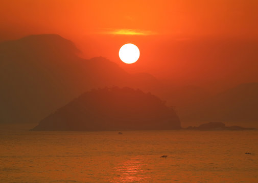 Fototapeta Breathtaking sunrise over the Atlantic ocean view from Copacabana beach of Rio de Janeiro, Brazil