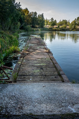 Obraz premium Lake near the town of Prypjat in Ukraine, which is one of the most dangerous places in the planet. Lake full of hazardous radioactive waste. after the nuclear disaster in Chernobyl. Captured 30 years 