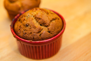 Macro Closeup of a Baked Blueberry Banana Soufflé in a Red Ramekin