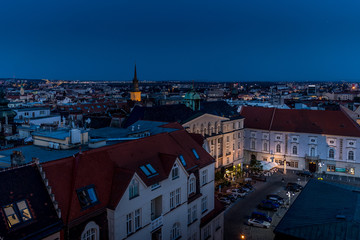 Fototapeta premium Brno and one of its big square called Zelny market during season you can buy many vegetables and fruits captured during sunset with city light