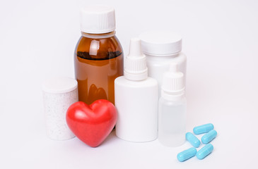 Cap screw lid angina pectoris clinic dose concept. Close up photo of medical bottles with fluid and...
