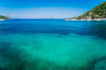 Azure clear water. Picturesque scenery of the bay with turquoise calm water, surrounded by cliffs