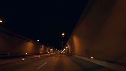 Car rides in the night tunnel