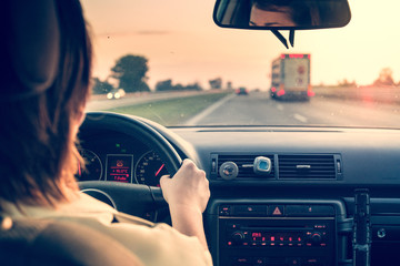 Woman driving a car.
