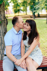 Obraz premium young loving couple walking in the park outdoors