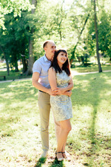 Fototapeta premium young loving couple walking in the park outdoors
