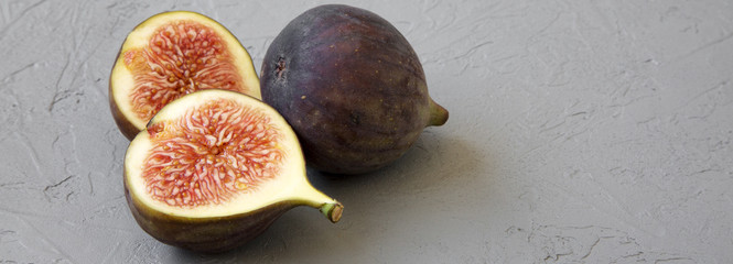 Fresh figs on concrete background, side view. Close-up.
