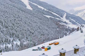 View of ski slopes and the parking of cars at a slope