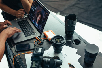 Equipments of a photographer on a table - obrazy, fototapety, plakaty