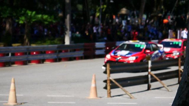 blurred image of racing sedan car