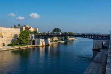 Fototapeta na wymiar Taranto Swing Bridge on the Canal Boat Separing the Little and the Big Sea