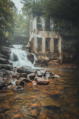 Abandoned building and a waterfall