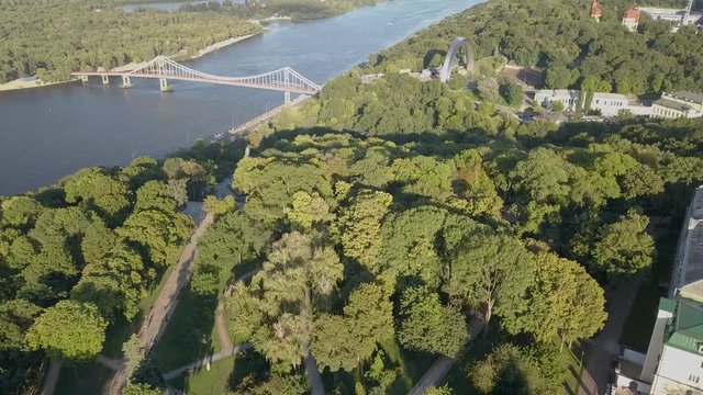 Aerial view to People's Friendship Arch with view to the bridge over Dnipro river to Hydropark island, Kyiv, Ukraine