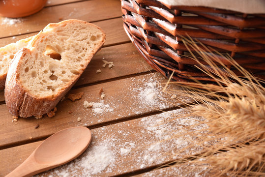 Breads over a table with wicker basket in kitchen detai
