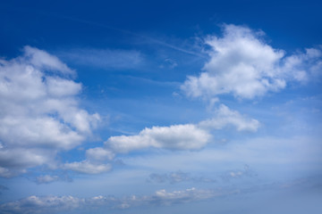 Blue sky white summer cumulus clouds