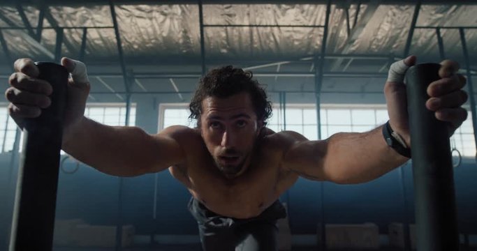 fitness man training bodybuilding workout muscular sportsman exercise using weights enjoying strength challenge in gym shirtless male athlete practice healthy lifestyle