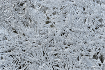 Rime, frost, ice texture. ice pattern texture. Ice on the winter lake. Closeup.