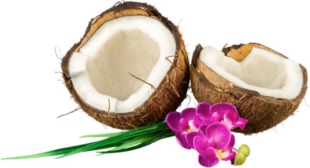 Fototapeta na wymiar Coconut split open with tropical flowers