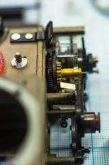 parts old retro film SLR camera on graph paper