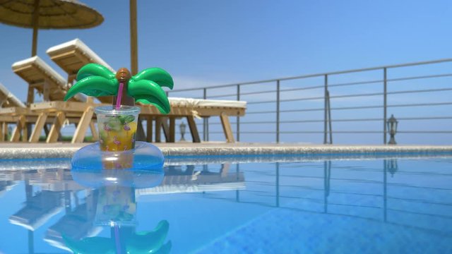 Inflatable Drink Holder With Flamingo Cup Floating In The Pool