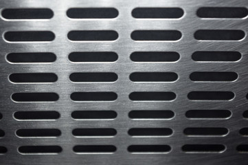 stainless steel grating with oblong holes, close up