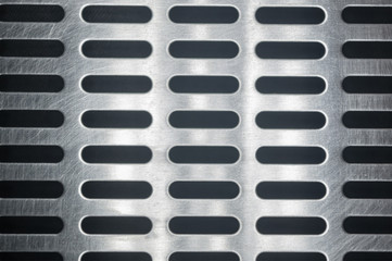 stainless steel grating with oblong holes, close up