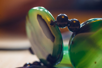 Large polished beads of beautiful translucent green agate gemstone, macro