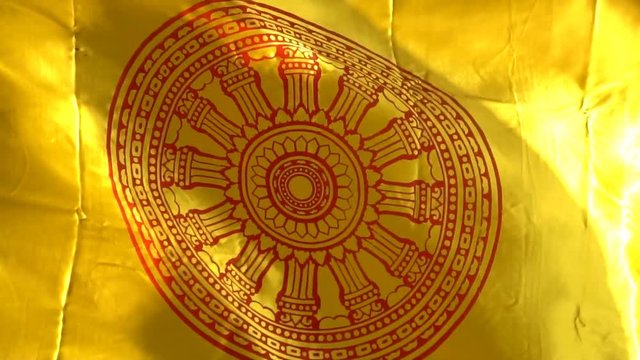 Buddhist wheel of life flag waving blown