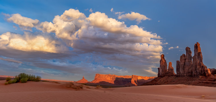 Monument Valley scene - dramatic red rock buttes and mesas kissed with light under dramatic skies © Elizabeth
