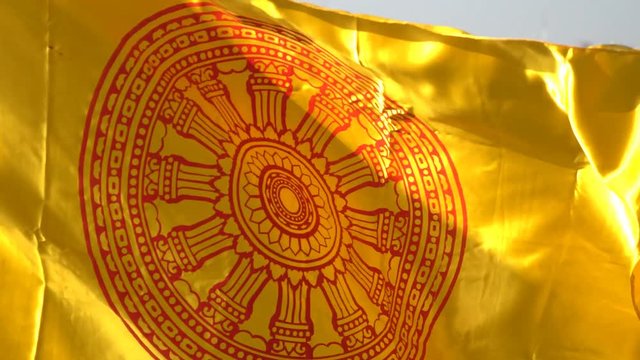 Buddhist wheel of life flag waving blown