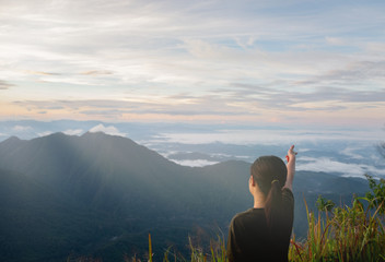 cute girl hiking on sunny days in the forest, the green hills. at Doi Phu Kha in Nan.