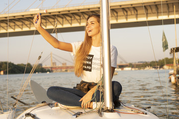 Attractive woman on sailboat