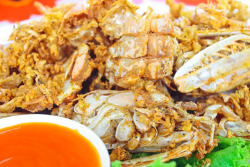 Crisp fried mantis prawn and garlic serve with chili sauce