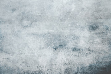 Pale blue grungy canvas background or texture with dark vignette borders