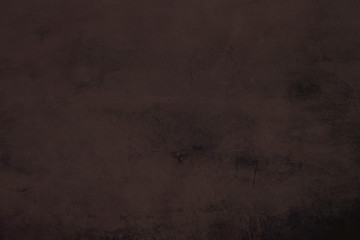 Brown grungy canvas background or texture with dark vignette borders
