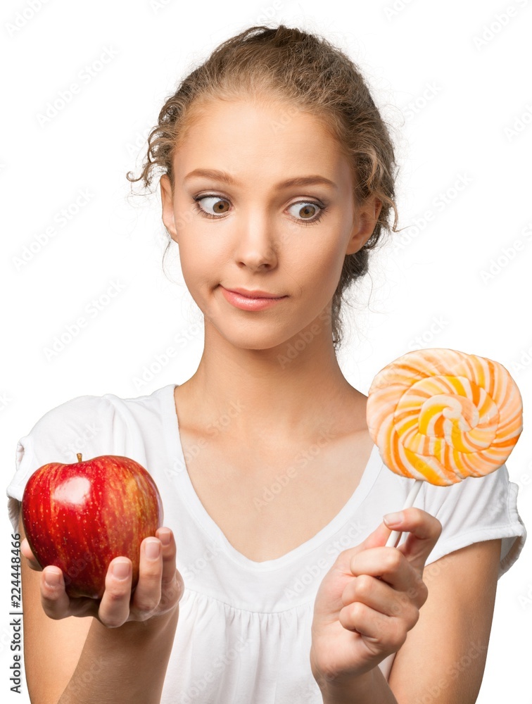 Canvas Prints Portrait of a Young Woman Choosing Between an Apple and a